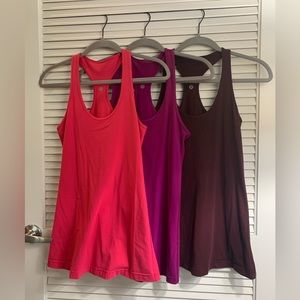 $30 - Qty (3) Lululemon Size 8 Fitted Tank - Purple, Pink & Maroon - New w/o tag